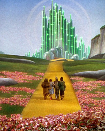 (The futuristic "Emerald City" in the 1939 film "The Wizard of Oz". The "wizard" who controls the city is a fraud who uses theatrical technology to disguise his lack of real power.)