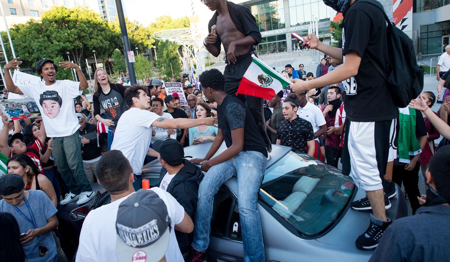 (Anti-Donald Trump protesters in San Jose, California in June. Trump supporters leaving a nearby campaign rally were attacked)